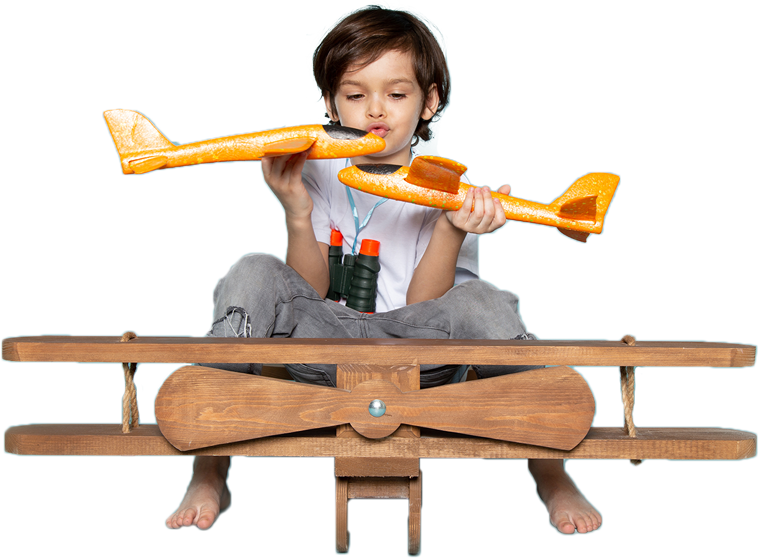 Child holding a toy plane